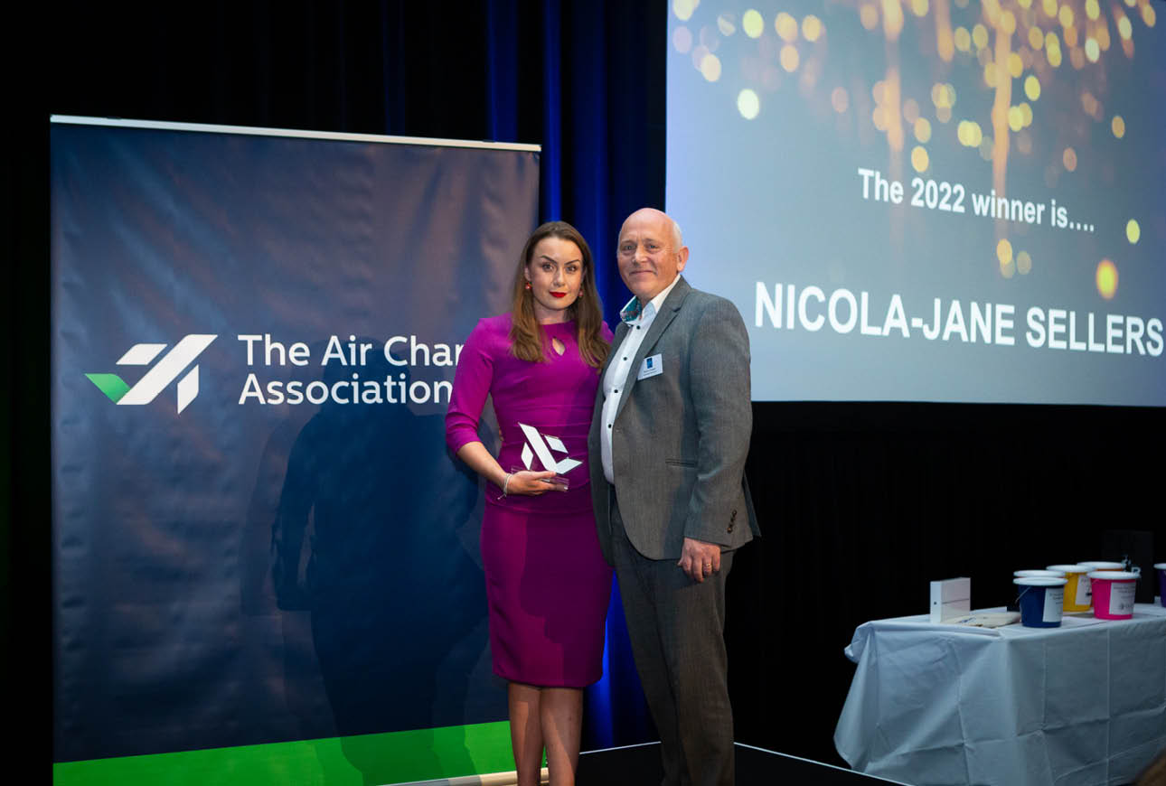 Awards presentation moment at a formal Air Charter Association industry event.