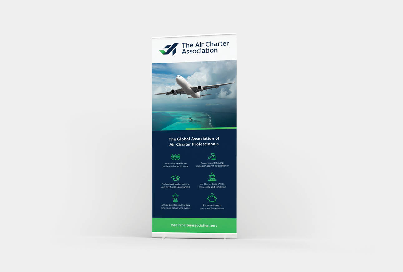 Roll‑up banner design for The Air Charter Association featuring aviation imagery and key services.