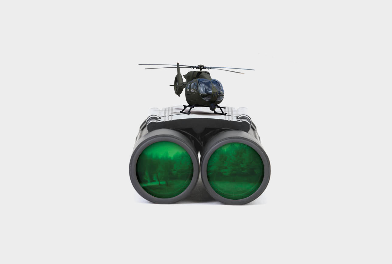 Airbus military helicopter on binoculars representing surveillance and defence aviation capabilities