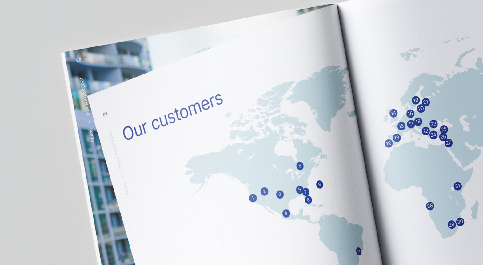 Annual report page displaying a global customer map visualising international reach and market presence.