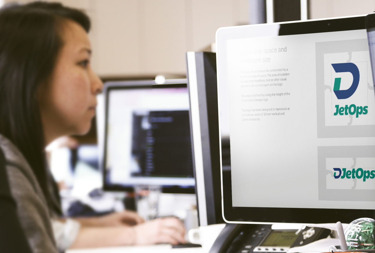 Woman at desk in branding agency creating branding guidelines