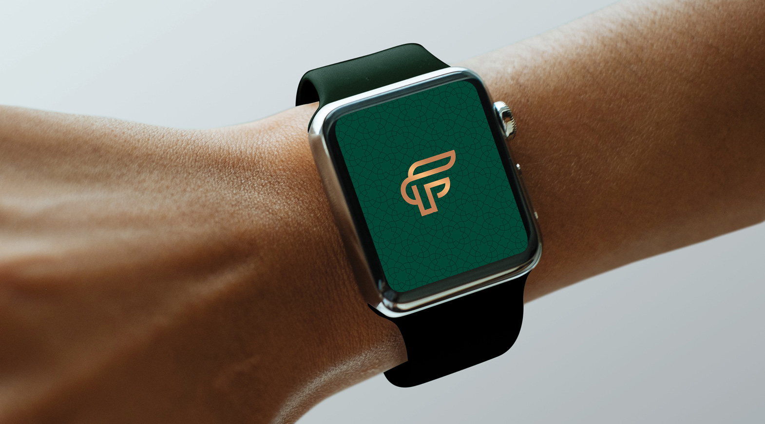 Luxury smartwatch displaying Forte aviation brand logo on green background