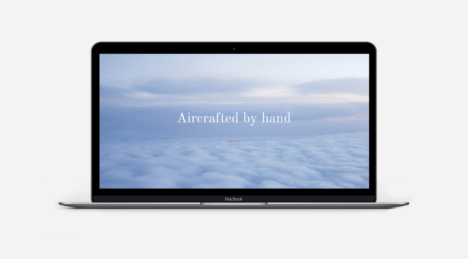 Private jet flying above clouds with “Aircrafted by hand” luxury aviation message