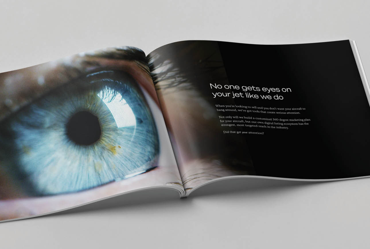 Brochure spread featuring close‑up eye imagery and messaging about attention and aircraft marketing