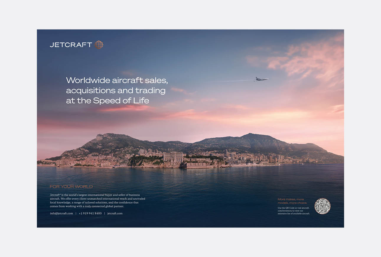 Jetcraft print advertisement showing aircraft flying over a coastal cityscape at sunset with brand messaging