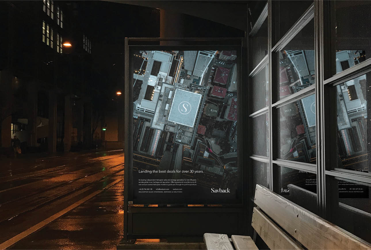 Savback helicopter services billboard advertisement in urban night setting