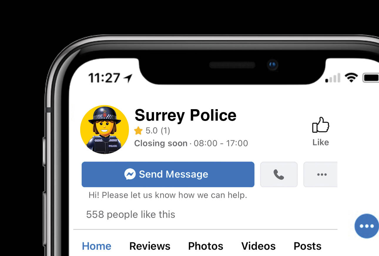 Surrey Police social media page on smartphone showing profile, reviews and message button