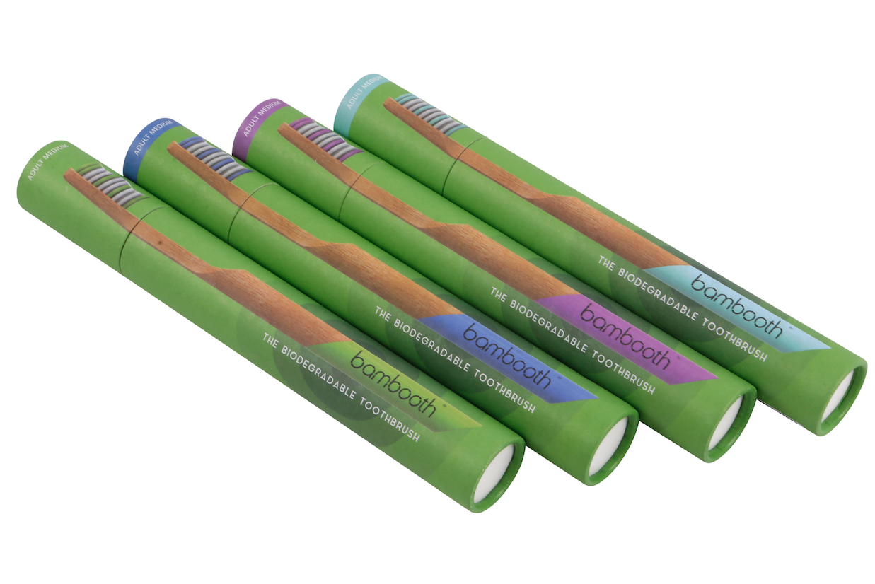 bamboo toothbrushes in their brand packaging